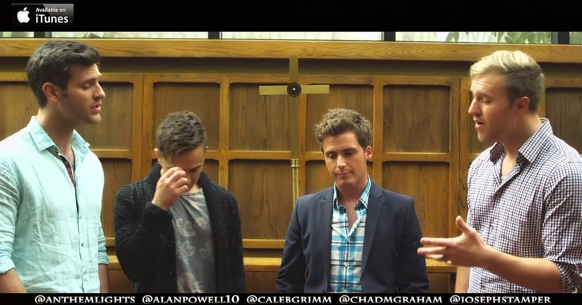 Four men in a church setting, one gesturing while others listen, with social media handles at the bottom.