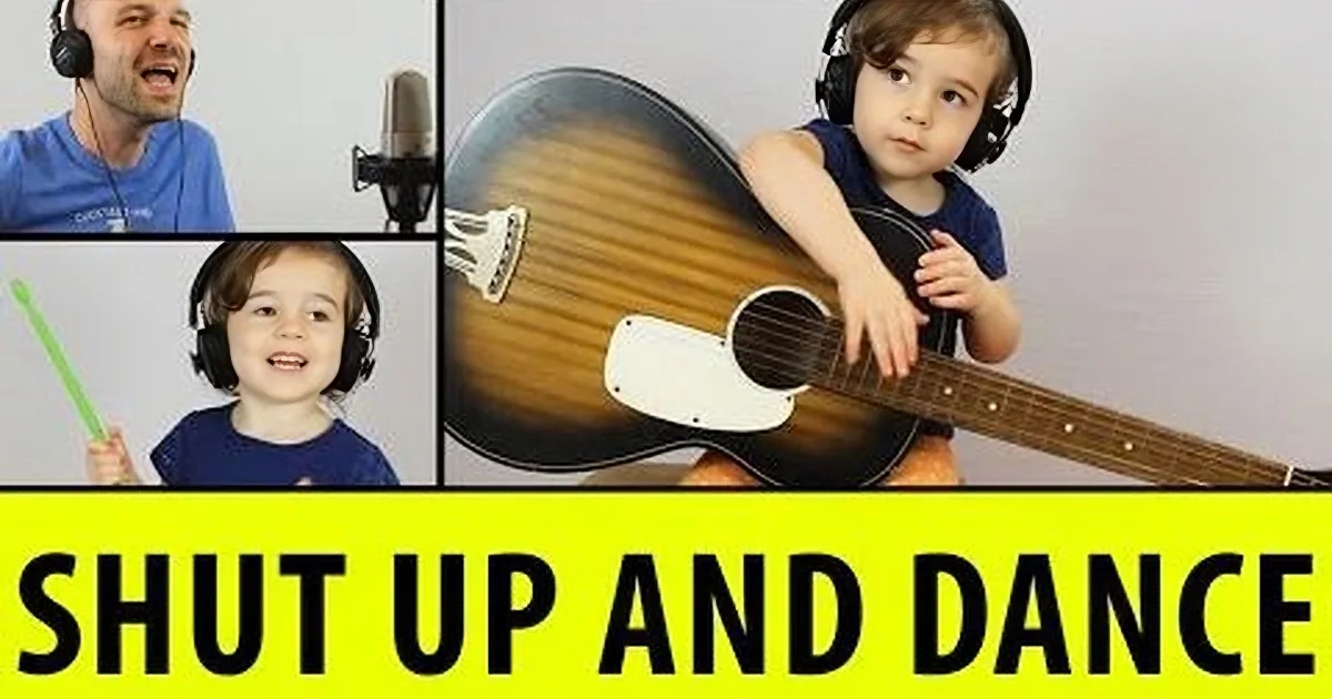 A child plays guitar while a man and another child sing, with text "SHUT UP AND JAM" overlaid.
