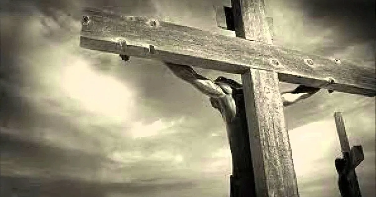 A crucifixion scene with a figure on the cross against a dramatic, stormy sky.