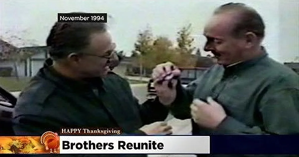 Two men in military uniforms shake hands, smiling, with "Happy Thanksgiving" text on screen.