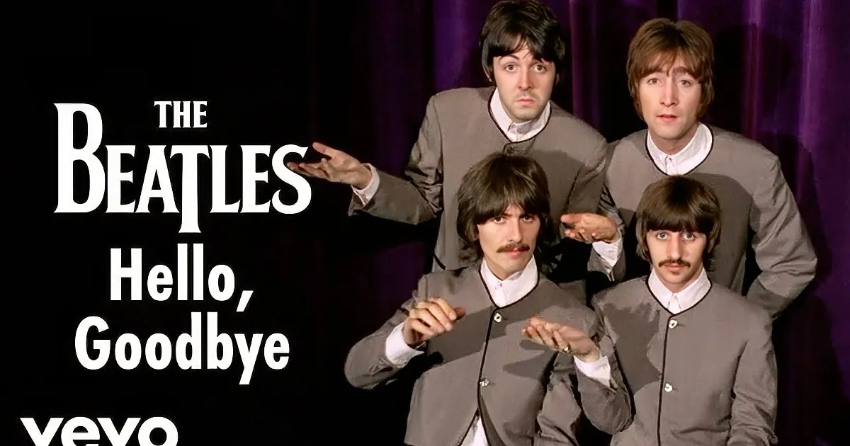 The Beatles in matching suits and purple pants, waving and smiling.