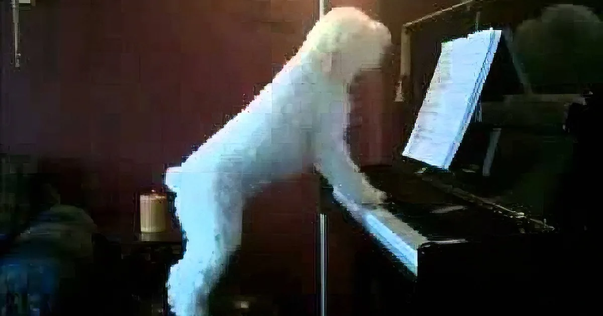 A person in a white fluffy costume plays a piano with sheet music.
