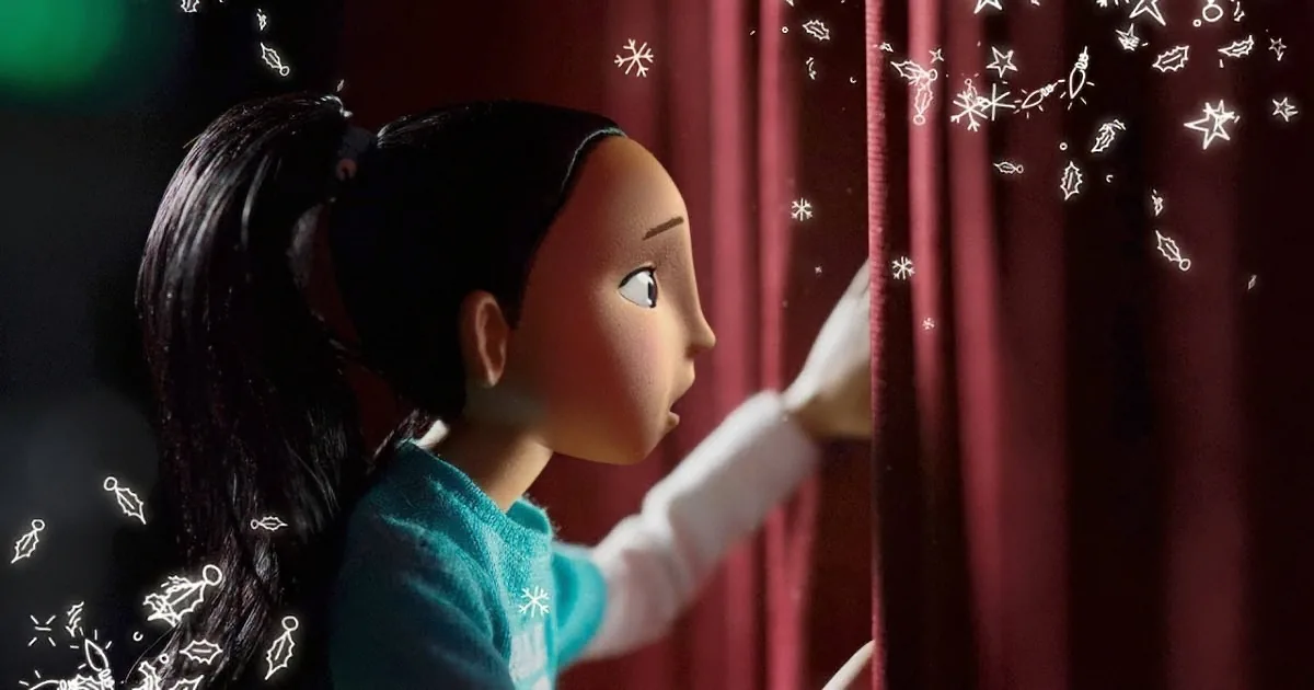 A young girl with long dark hair, wearing a teal sweater, gazes out a window with a red curtain, surrounded by festive...