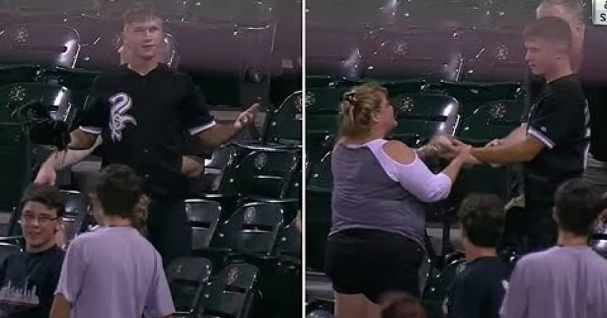 A man in a Chicago Bulls jersey interacts with a woman in a stadium setting.