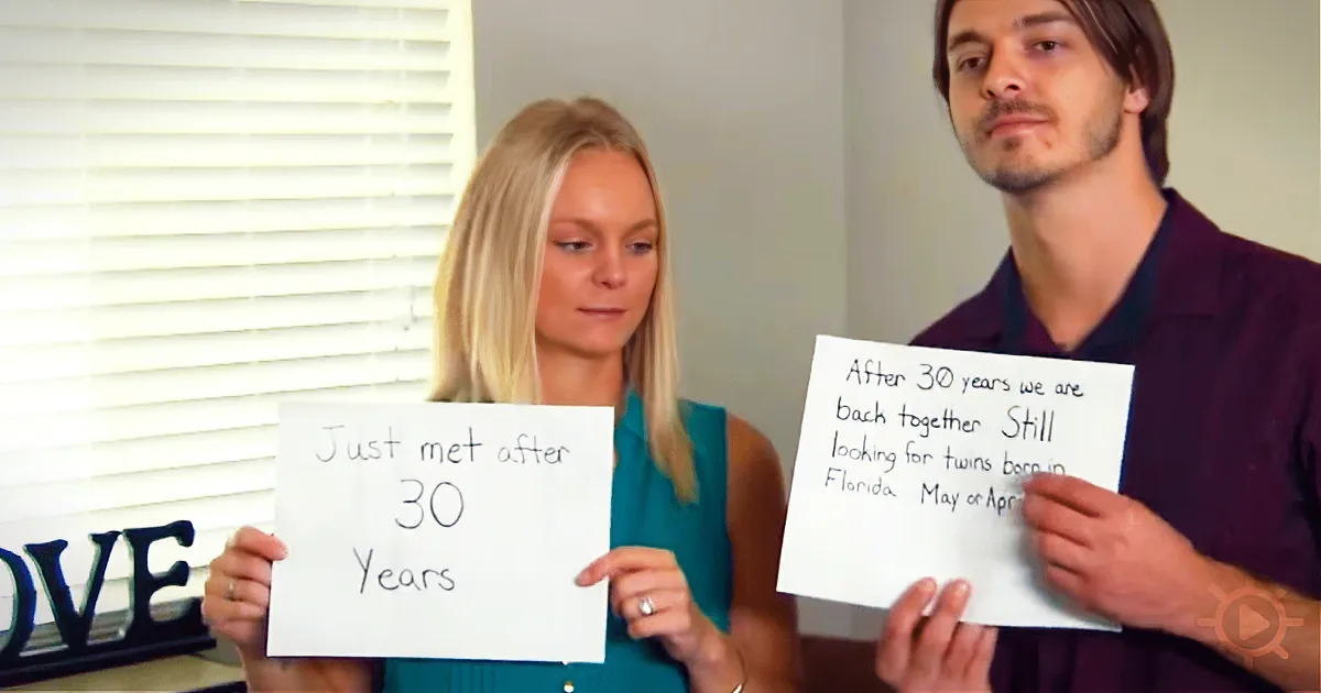 A couple holds signs: "Just met after 30 years" and "After 30 years we are back together."
