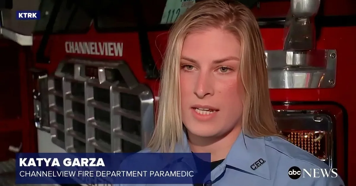 Katya Garza, a Channelview Fire Department paramedic, speaks in front of a fire truck.