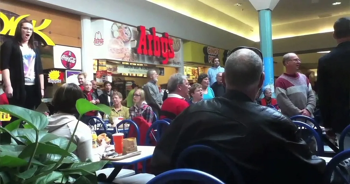 She Talks Loudly on Her Phone in the Mall - Then Other Voices Join for a Festive Performance