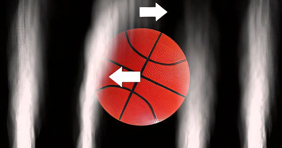 A red basketball with black lines is shown against a dark, smoky background with white arrows pointing left and right.