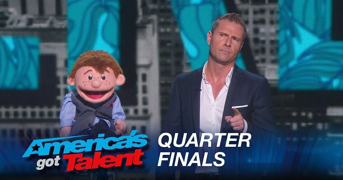 A man in a suit sits beside a puppet on stage, with "America's Got Talent Quarter Finals" text overlay.