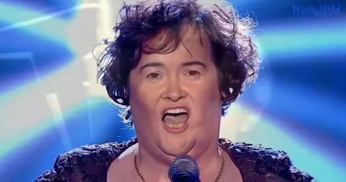 A woman with curly hair sings passionately into a microphone, wearing a dark patterned top.