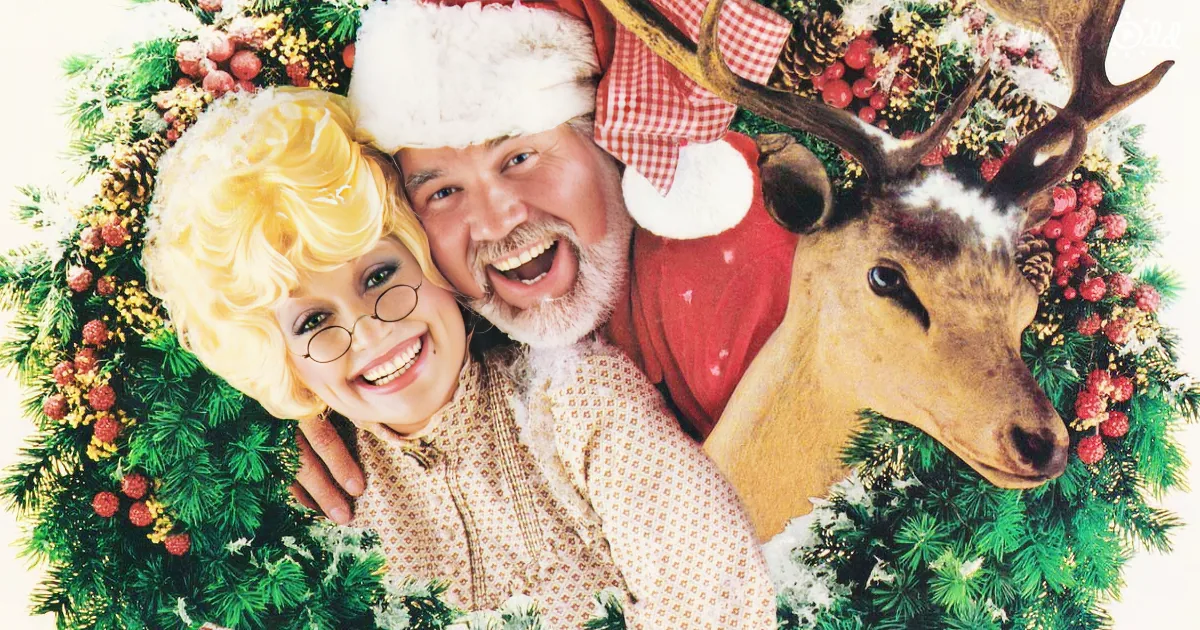A festive Christmas scene with a smiling couple and a reindeer amidst a wreath.