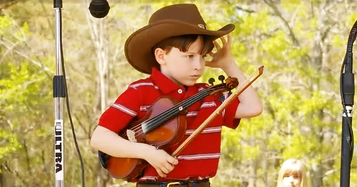 Adorable Mini Fiddler Steps up to the Mic and Adjusts His Giant Cowboy Hat, but When He Starts to Play...