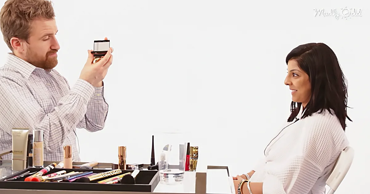 A man holds a compact mirror, examining it, while a woman sits nearby, surrounded by makeup products.