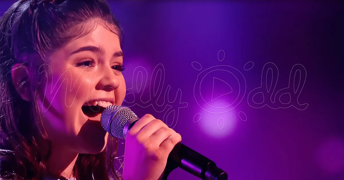 A person singing into a microphone with a purple background and text overlay.
