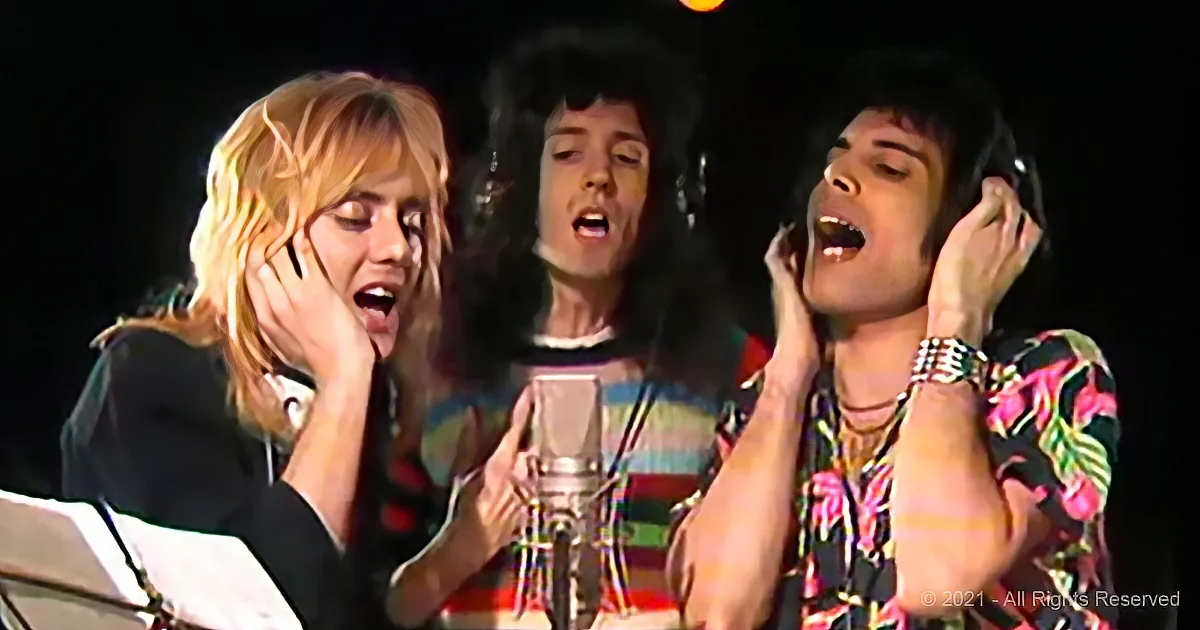 Three individuals singing passionately, one holding a microphone, wearing colorful outfits.
