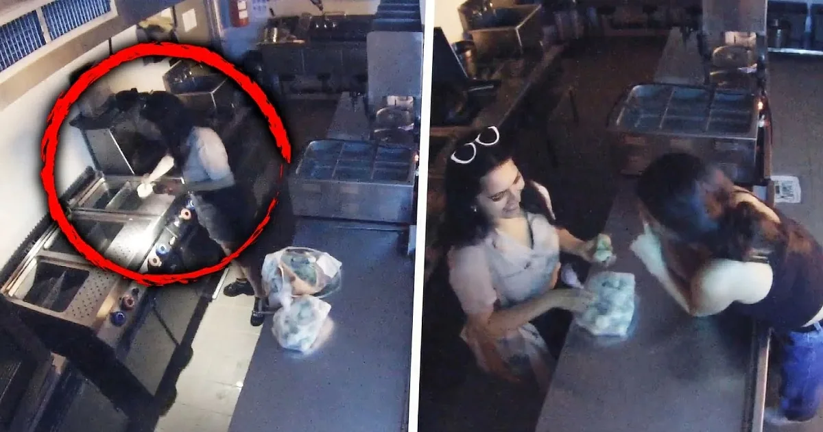 A person in a kitchen area, possibly preparing food, with a blurry background and some equipment visible.