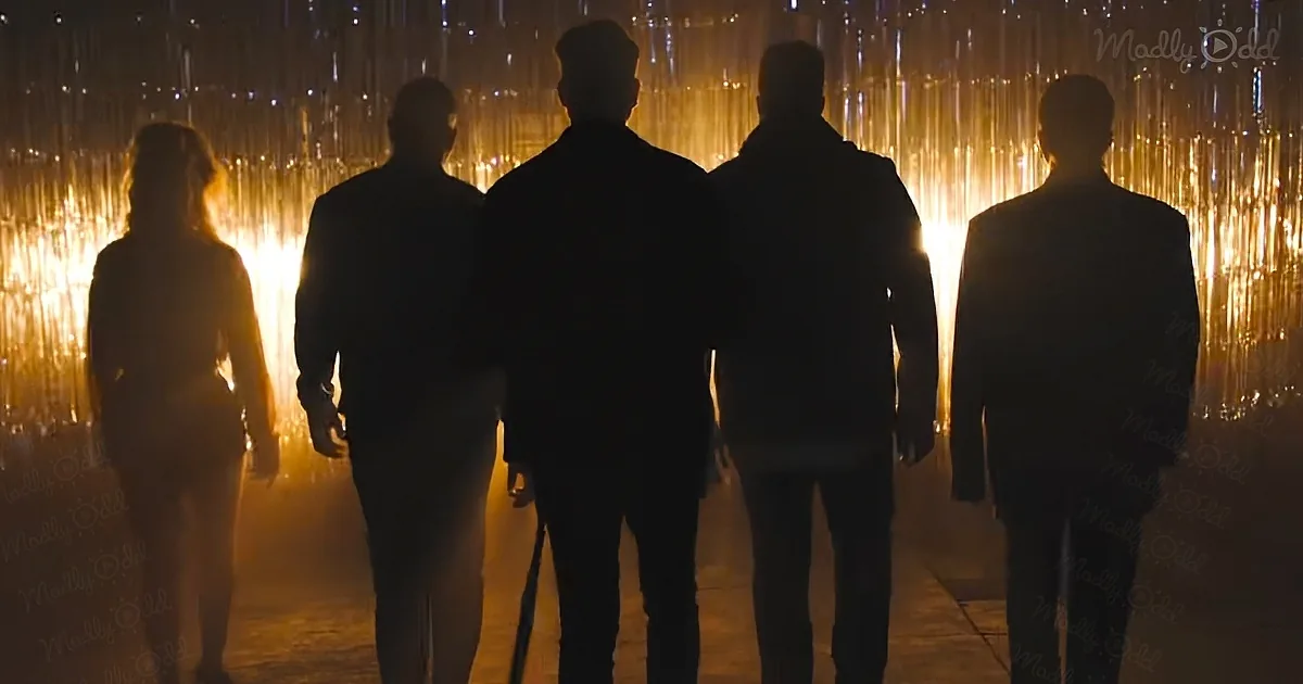 Four silhouetted figures walk away from a glowing, textured backdrop.