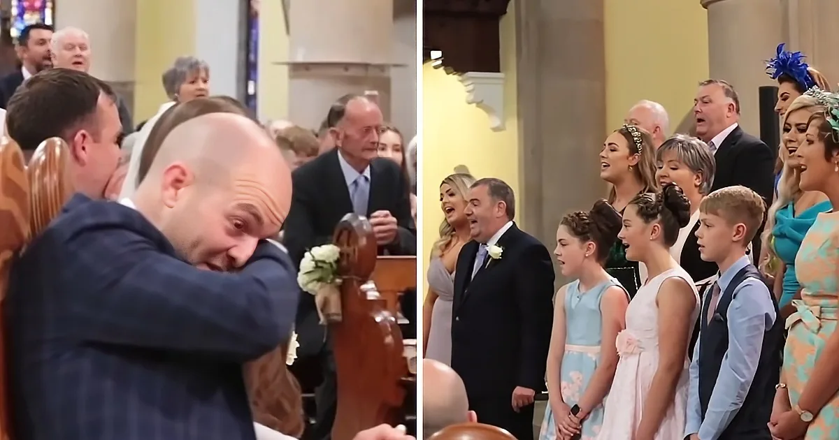 A man in a suit is visibly emotional, covering his face, while a choir sings in a church setting.