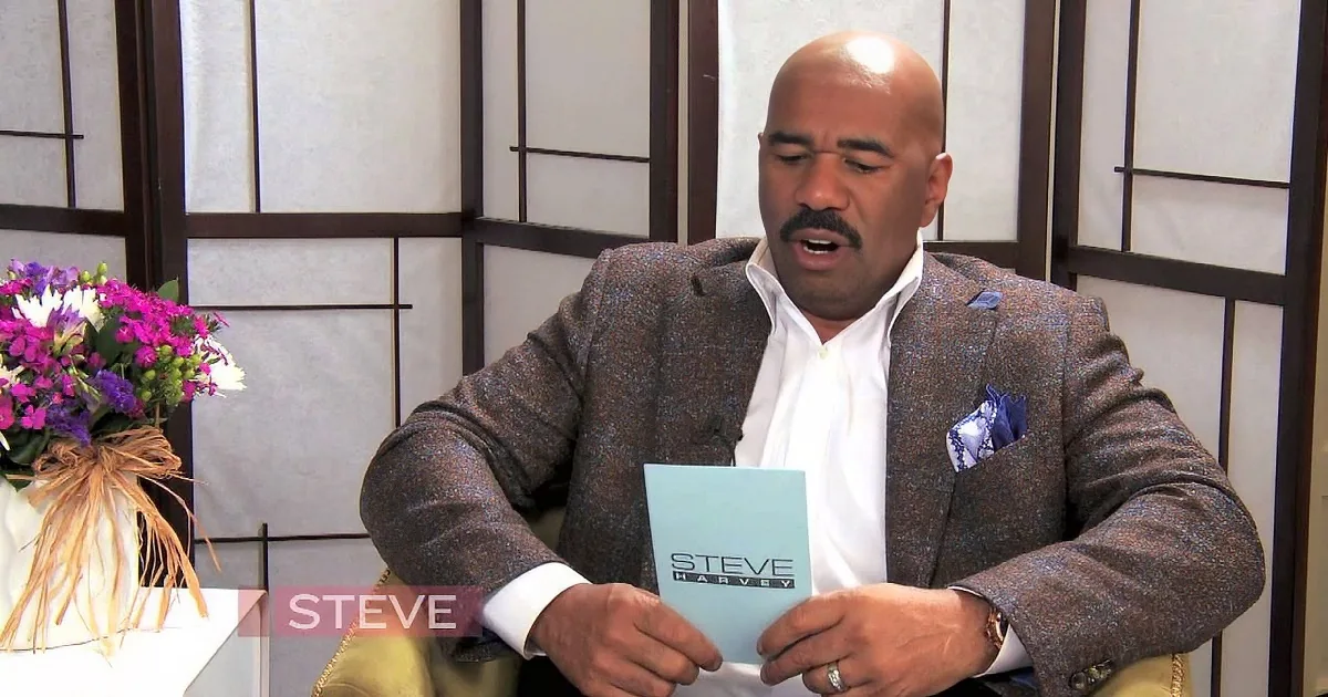 A woman in a blue outfit and a man in a brown suit holding a card.
