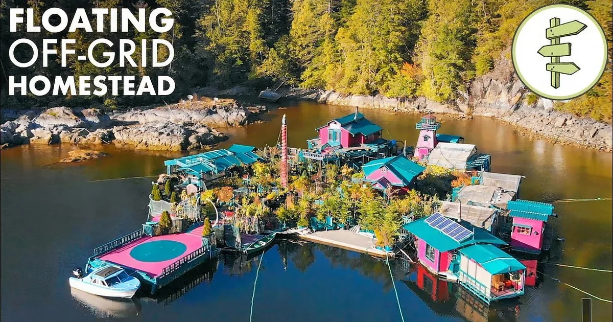 A vibrant floating community with colorful houses, a trampoline, and lush greenery surrounded by water and forest.