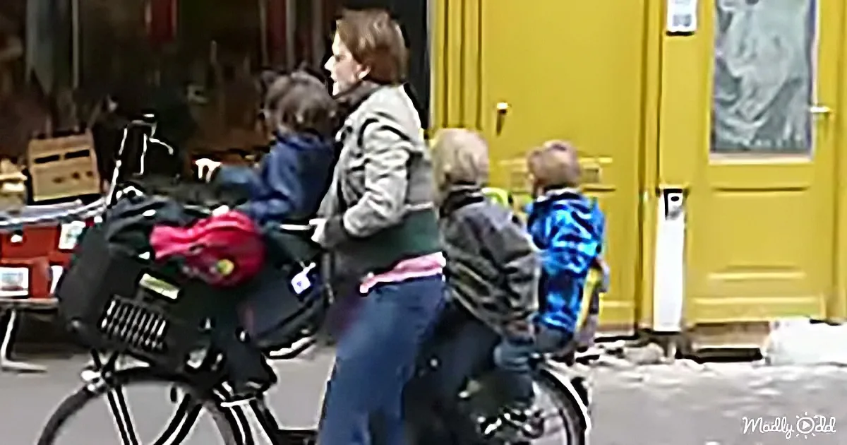 Three Kids and One Multi-Tasking Super Mom on a Bike