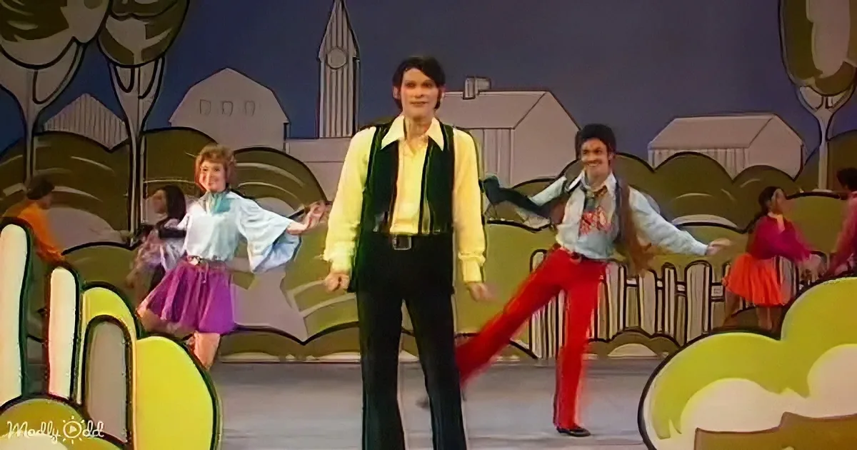 B.J. Thomas smiling as rain falls on him during his performance