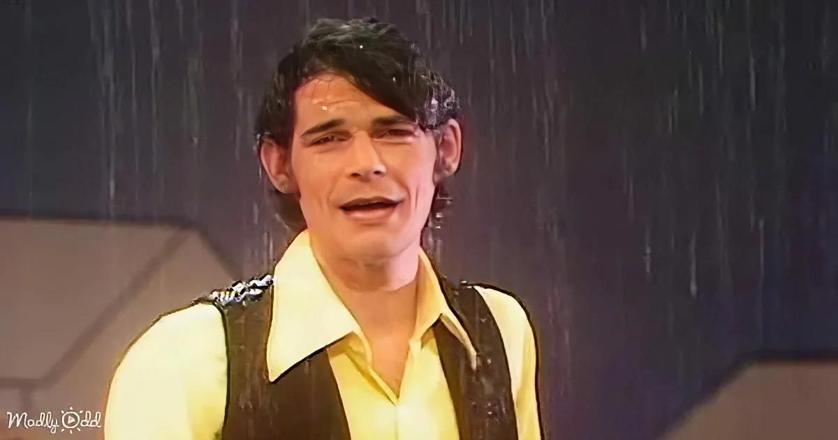 B.J. Thomas getting soaked under a rain cloud while smiling