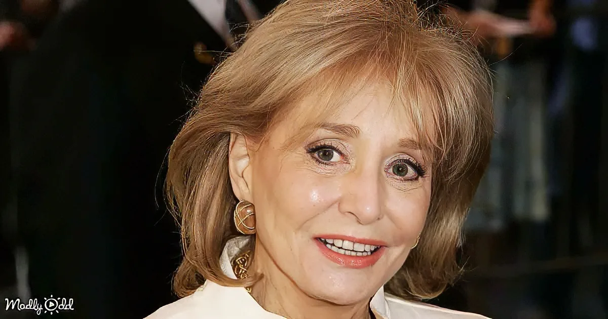 A smiling woman with light brown hair, wearing gold earrings, and a white outfit.