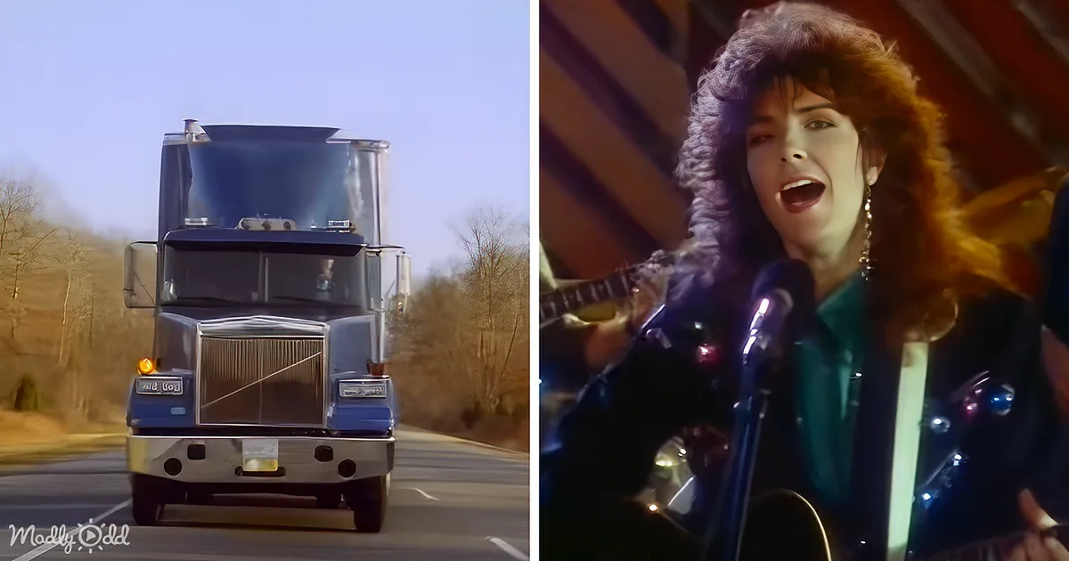 A large semi-truck drives on a road, while a woman sings into a microphone, holding a guitar.