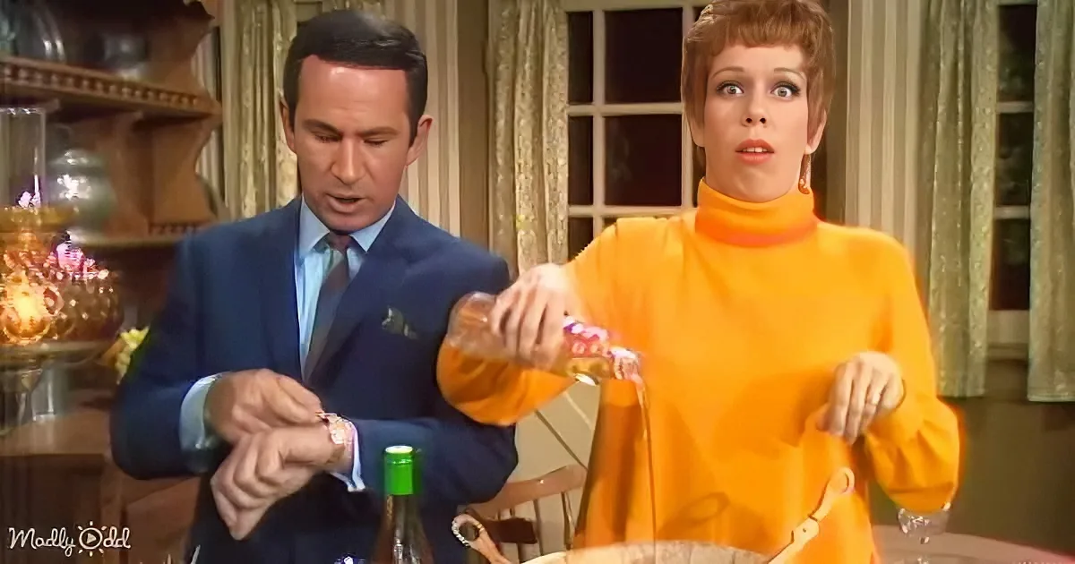 Woman in orange turtleneck pours liquid, man in suit checks watch, vintage setting.