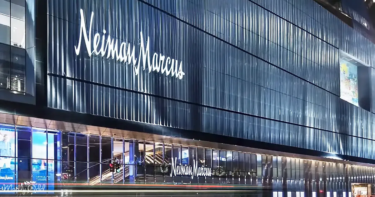 A modern building with the illuminated "Neiman Marcus" sign prominently displayed on its facade.