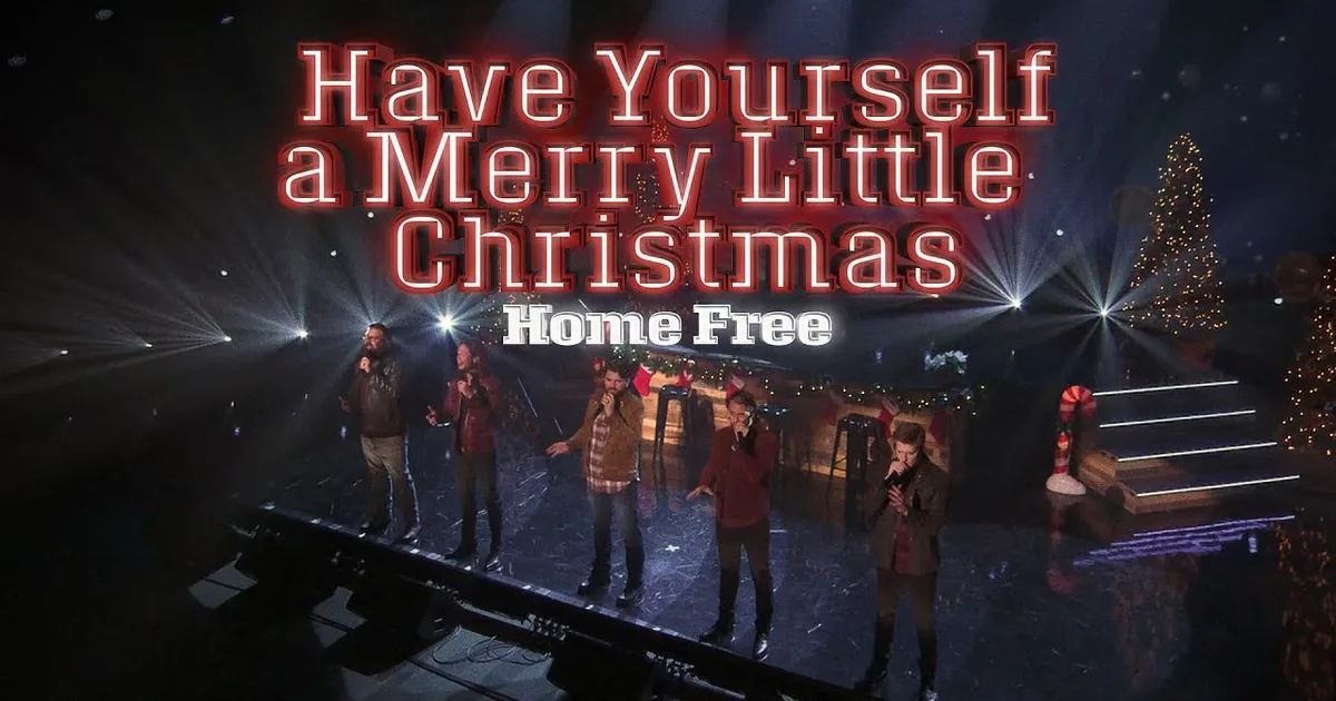 Five men in matching red Christmas sweaters stand in a row, smiling and gesturing, with decorated Christmas trees and...