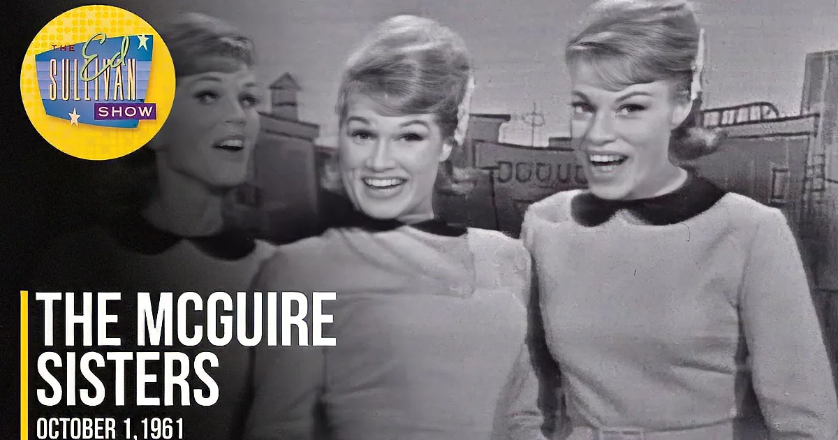 Three women in matching outfits smile and pose together in a vintage setting.