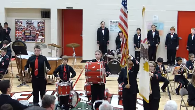 Boy drops cymbal during anthem