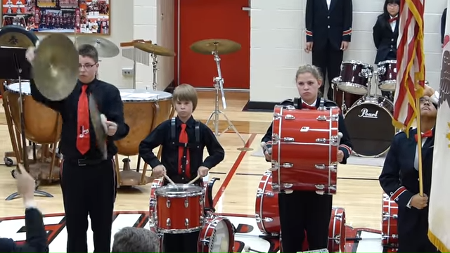 Boy drops cymbal while playing national anthem