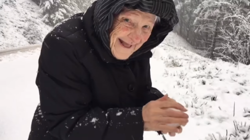 Grandma stops car to make snowball