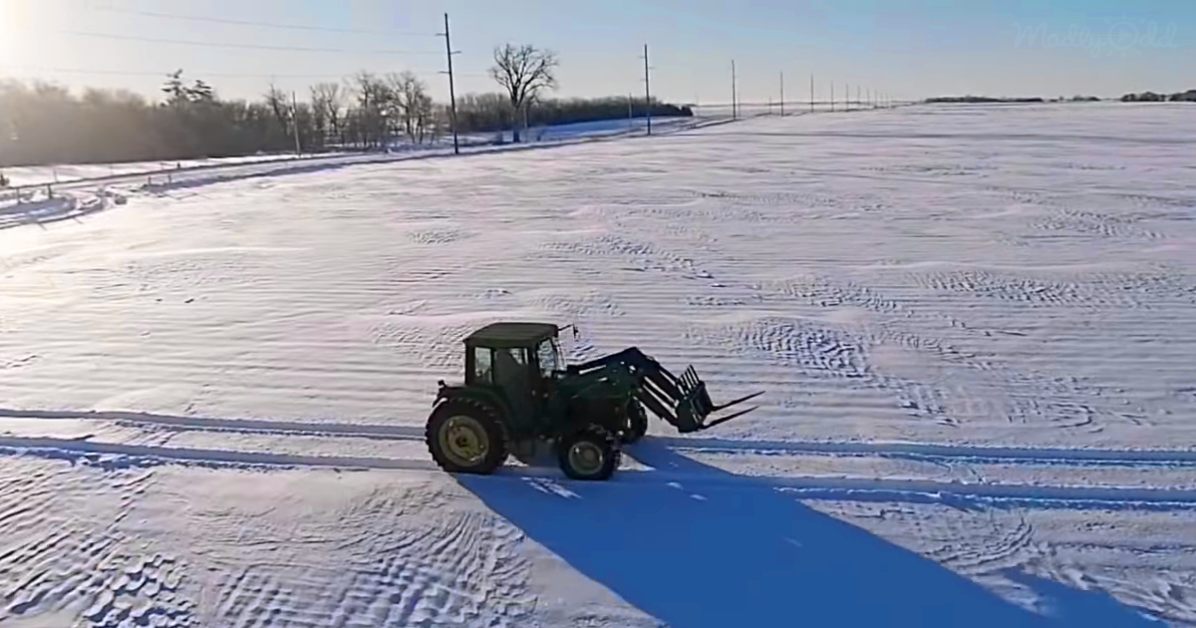 Farmer Writes Message in snow with tractor