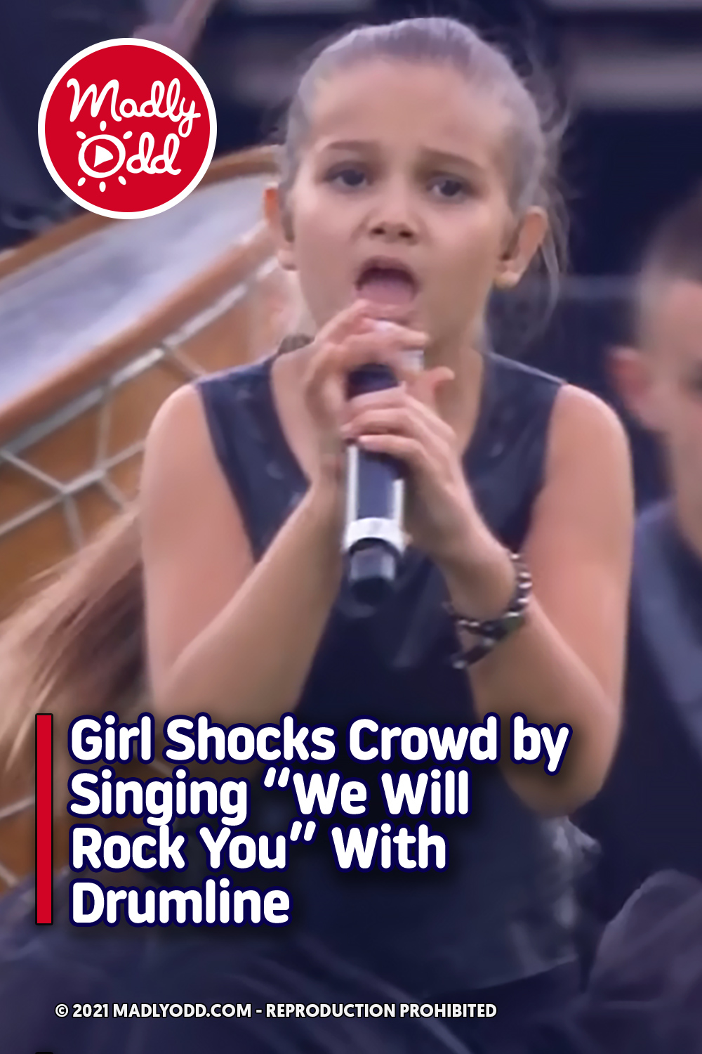 Girl Shocks Crowd by Singing “We Will Rock You” With Drumline