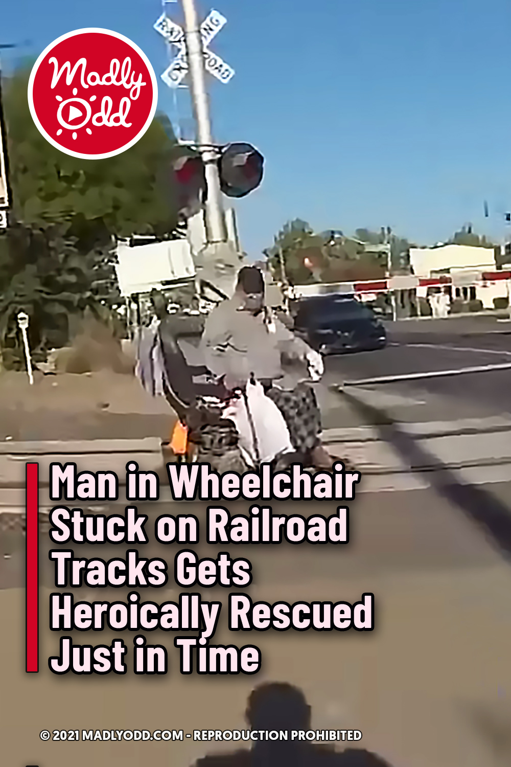Man in Wheelchair Stuck on Railroad Tracks Gets Heroically Rescued Just in Time