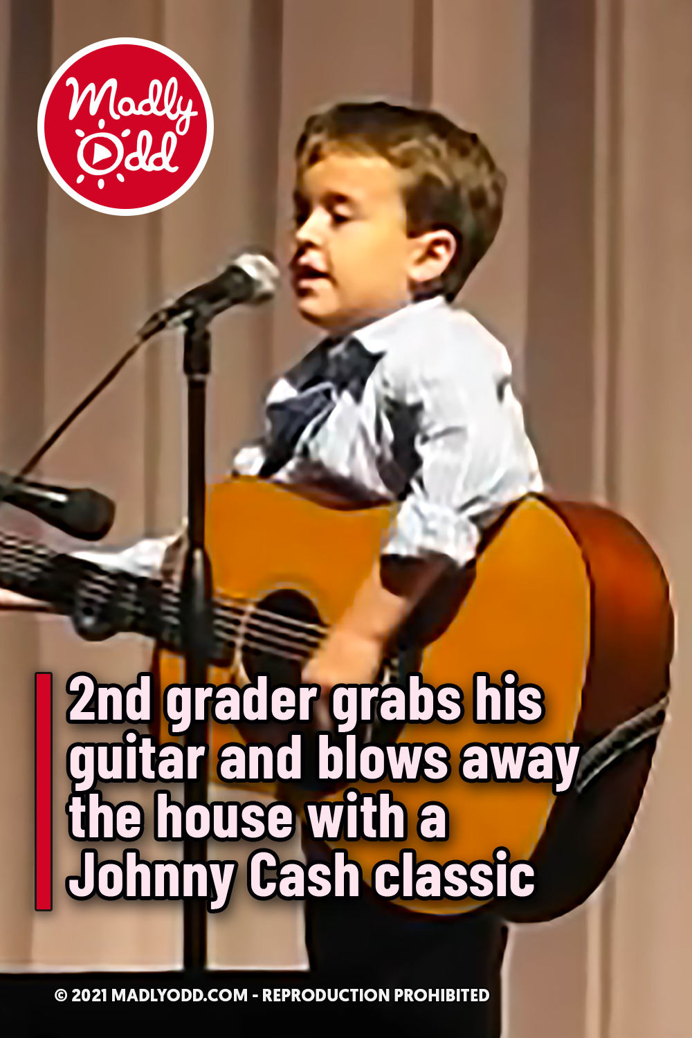 2nd grader grabs his guitar and blows away the house with a Johnny Cash classic