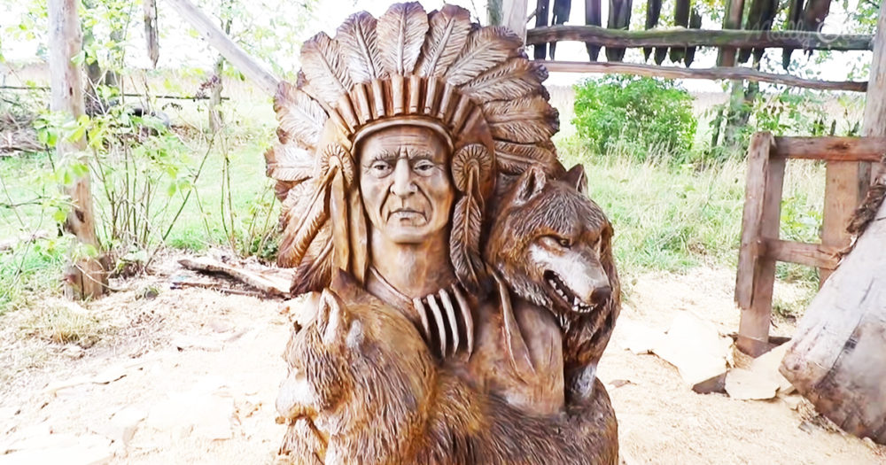 Native American with wolves wood art created entirely with chainsaw