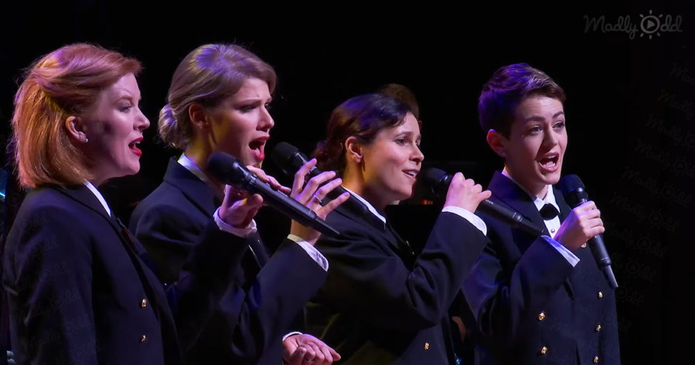 Four Navy women singing