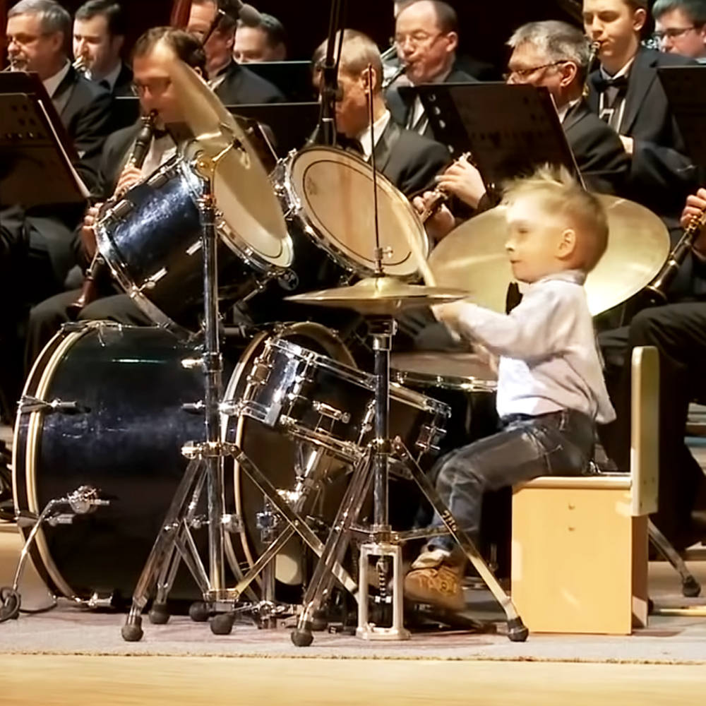 3-year-old boy playing the drums