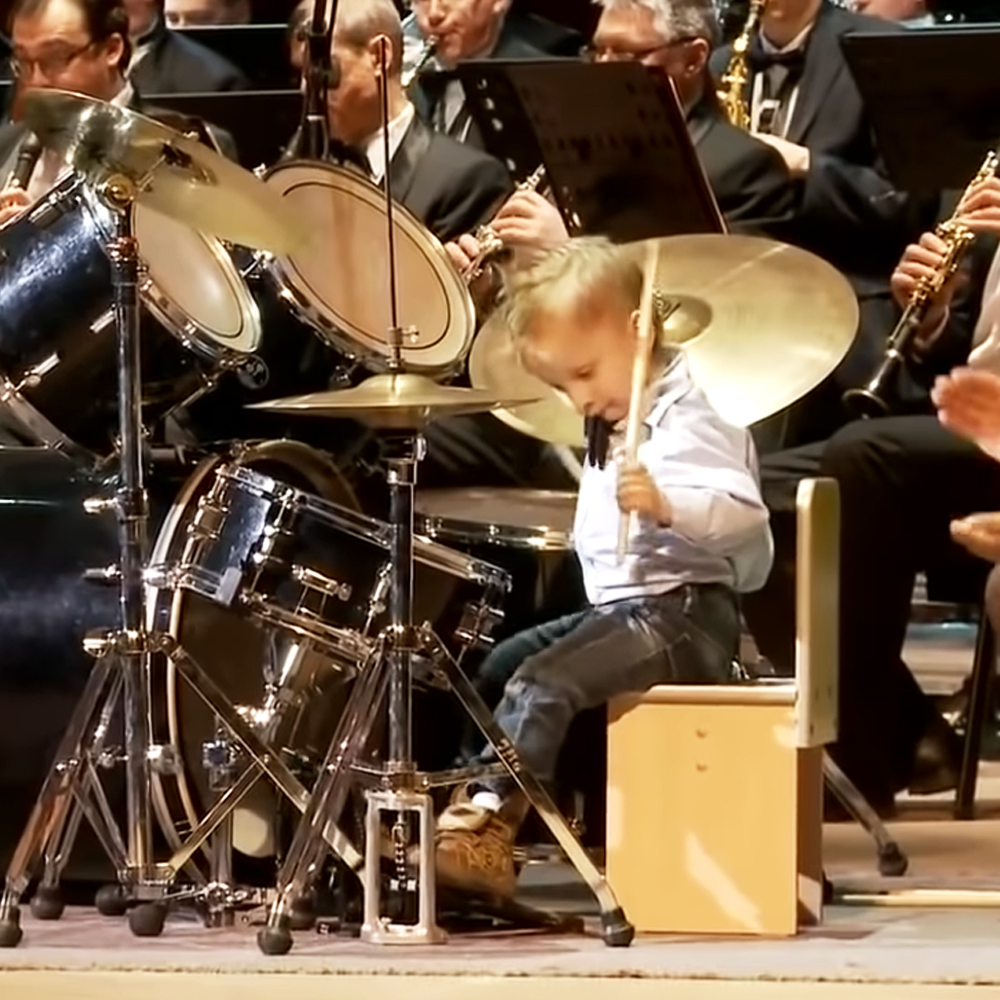 3-year-old boy playing the drums