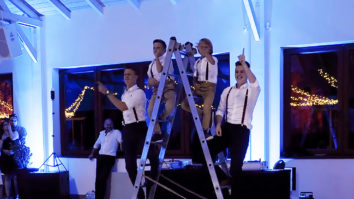Brothers dancing at sister's wedding on ladder