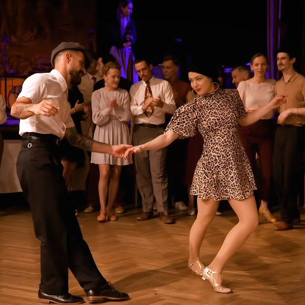 Couples performing jaw-dropping swing dance