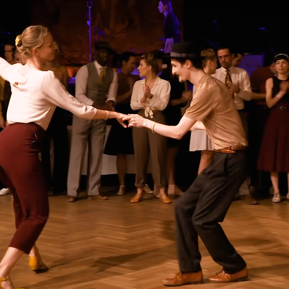 Couples performing jaw-dropping swing dance 