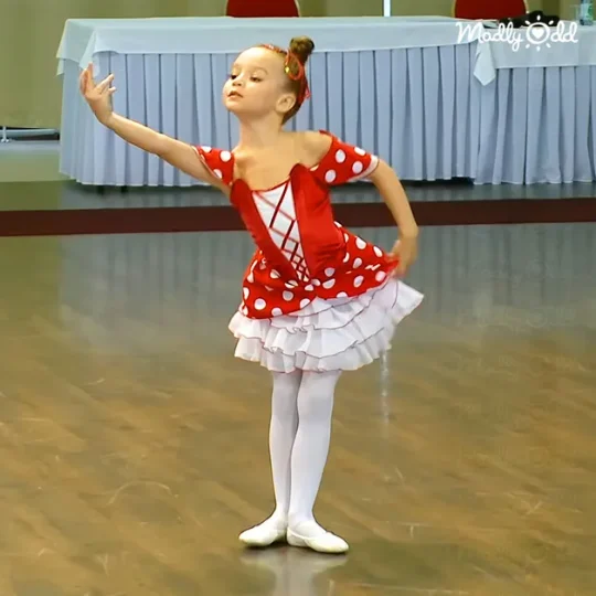 Little ballet dancer in red and white lace tutu