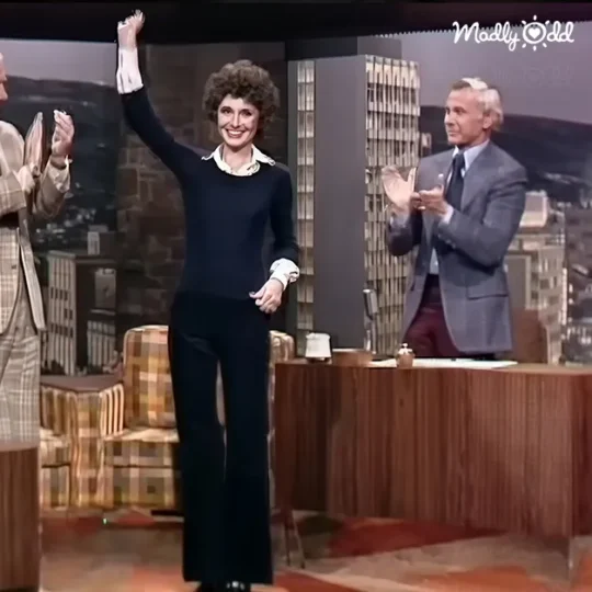 Johnny Carson interviews Audrey Hepburn, both smiling, chemistry evident.