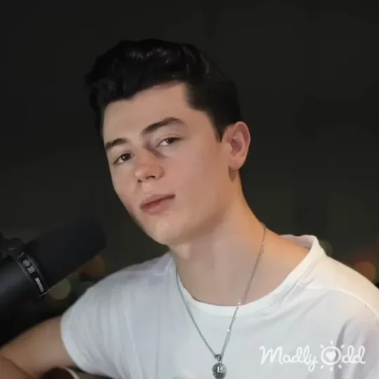 Elliot James Reay sings 'Unchained Melody' in dimly lit room, creating a haunting atmosphere.